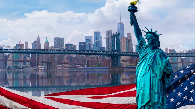 statue of liberty and american flag